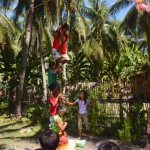 Climbing an oiled bamboo pole